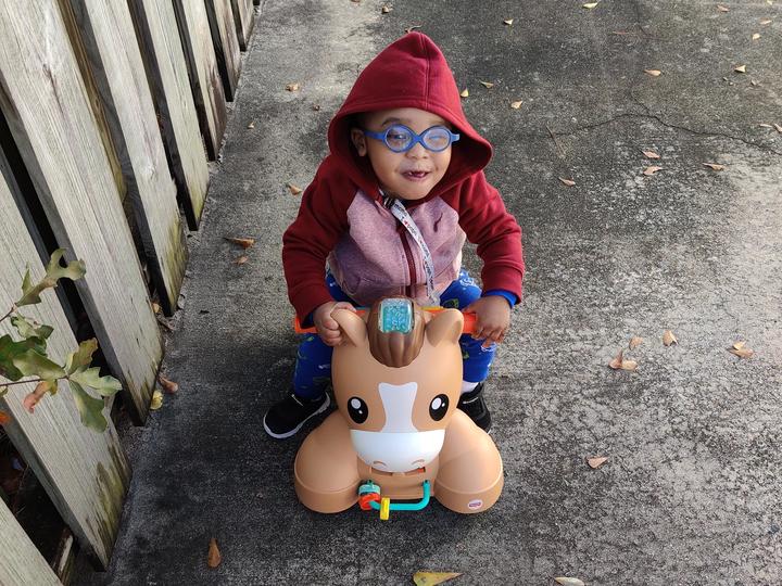 toddler riding a toy
