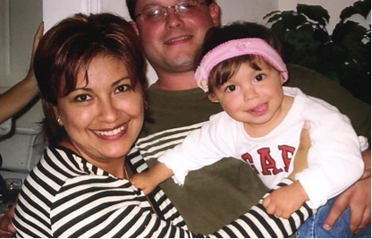 Isabella as a baby with her parents.