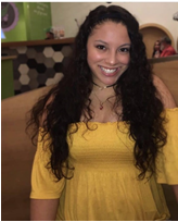 Isabella Rodriguez smiling in a yellow dress.
